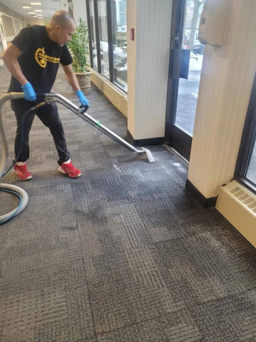 AAFM technician deep-extraction cleaning a commercial carpet